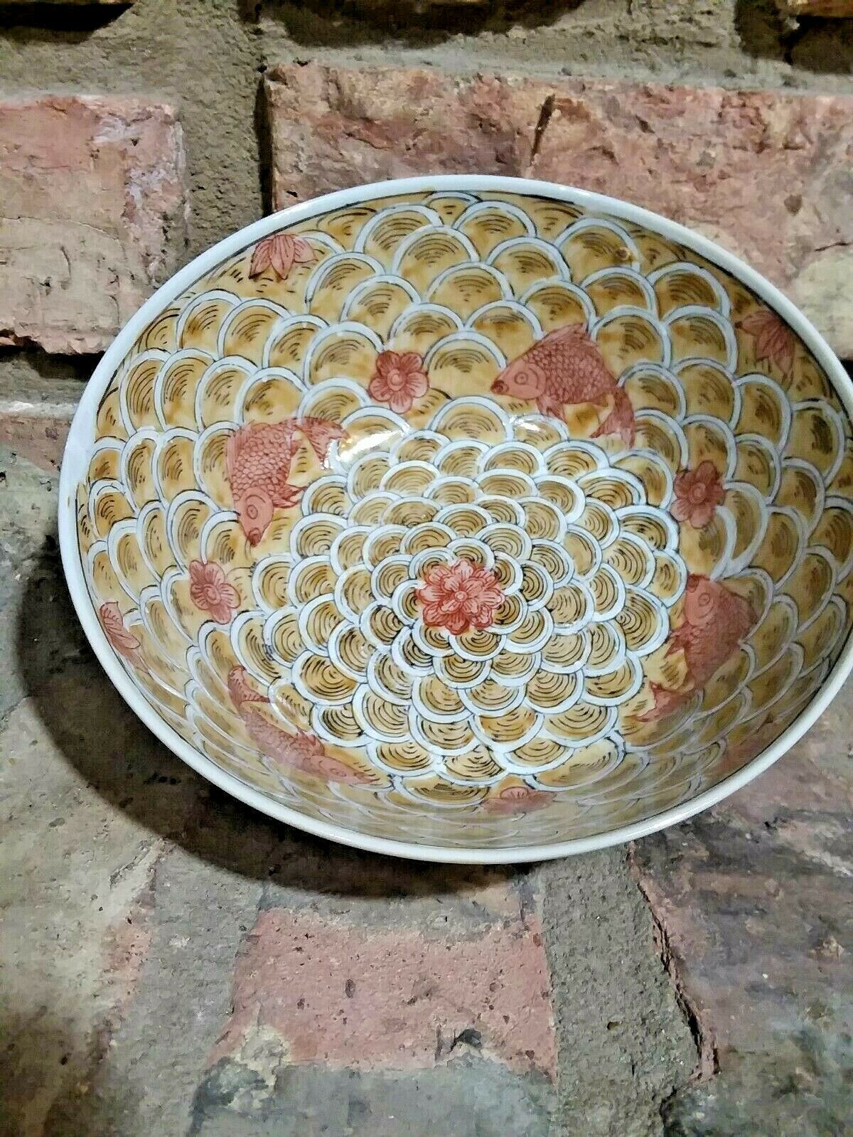Brown Bowl With Fish Scales And Pink Fish And Flowers Design